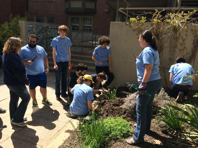 Students gathered outdoors in a garden