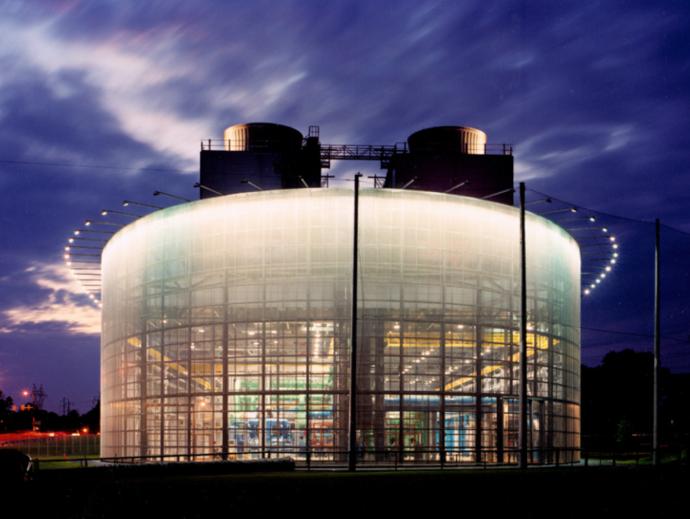 lights from the chiller plant make the structure bright on a cloudy evening