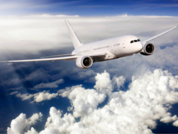 Picture of a plane flying amongst the clouds