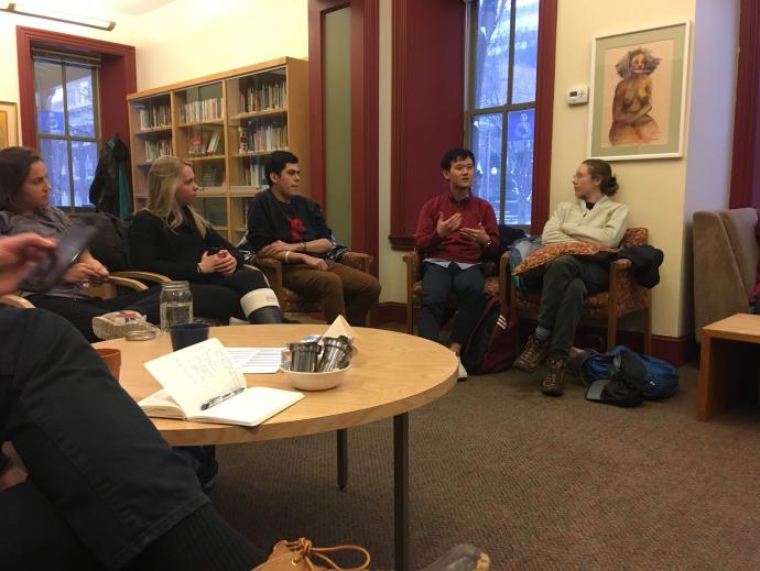 People talking indoors, seated