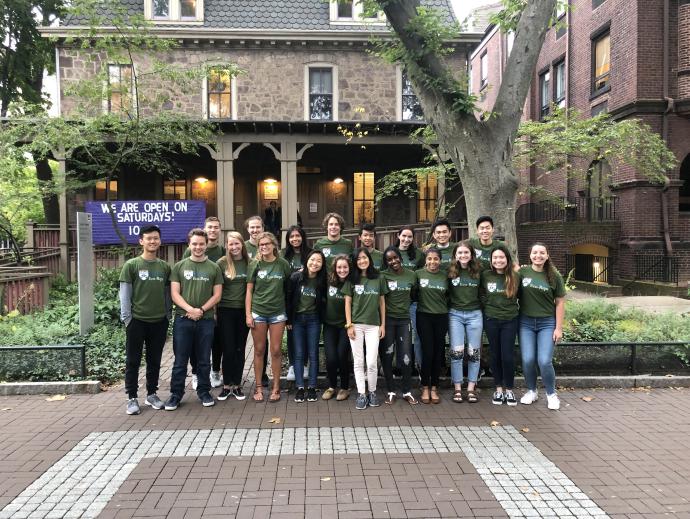 Smiling group of students in green shirts