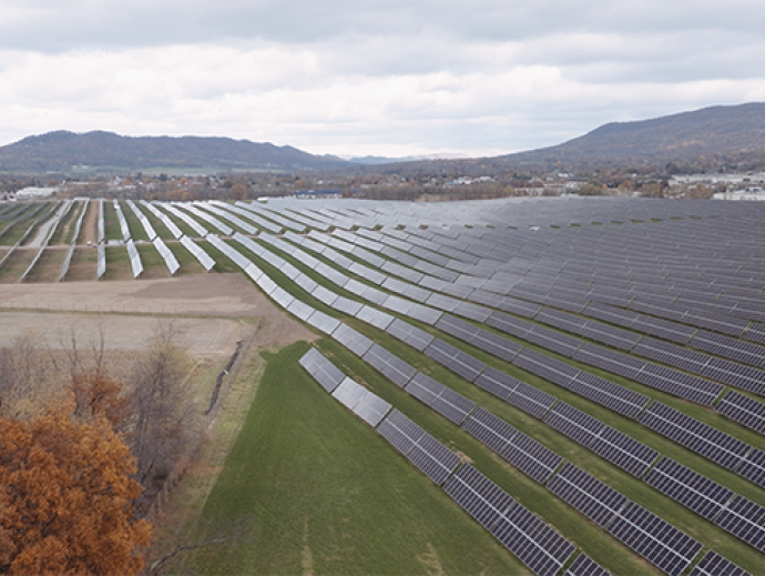 solar field with fall trees CREDIT AES