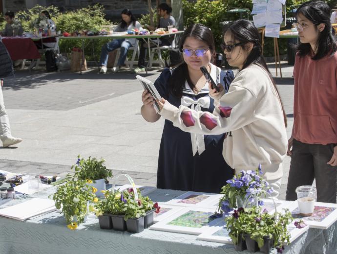 two students at display table